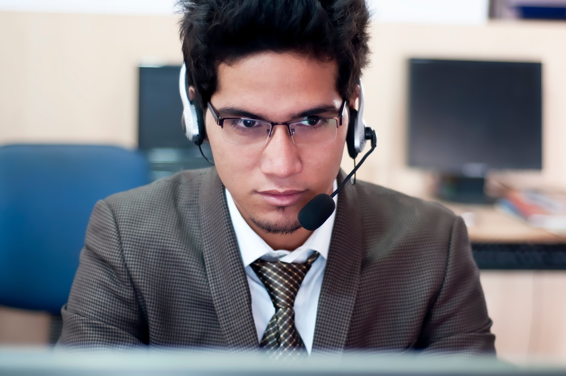 A businessman on a headset taking a call