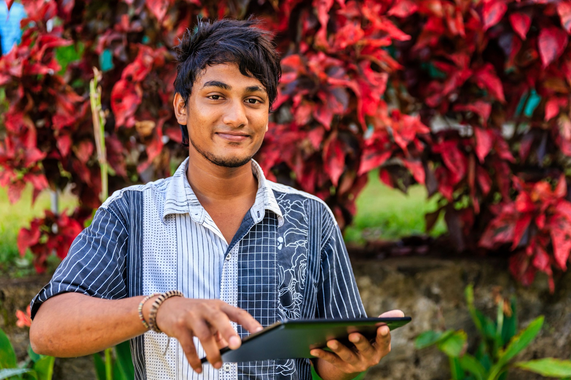 Sri Lankan teenager using a digital tablet